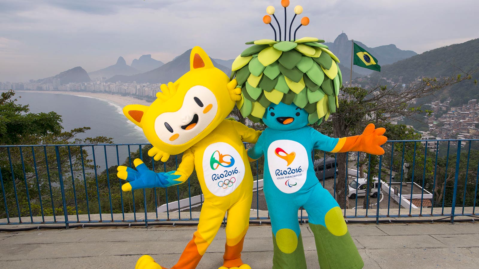 In this photo released by Rio 2016 Organizing Committee for the Olympic and Paralympic Games, the mascots of Rio 2016 Olympic, left, and Paralympic Games pose for a photo at the Leme Fort, with Copabana beach, left, in the background, in Rio de Janeiro, Brazil, Sunday, Nov. 23, 2014. The Mascots are inspired by the Brazilian fauna and flora. (AP Photo/Rio 2016, Alex Ferro)